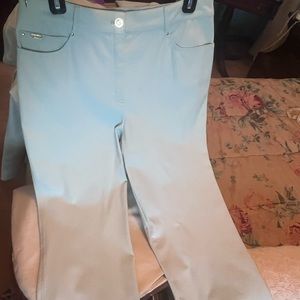 This is a petit St. John’s light mint pant suit in size small.